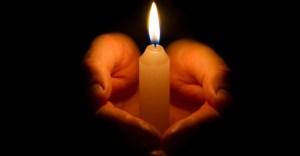 30723-hands-candle-facebook.800w.tn